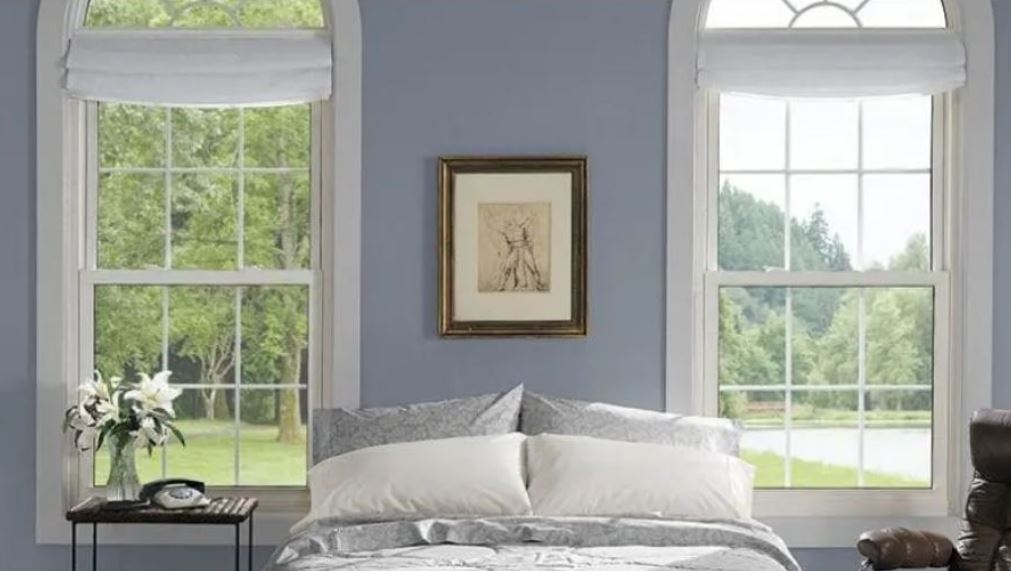 bedroom with tall arched windows in plano, tx